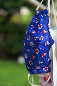 Selective focus hand-made fabric face mask use cute anchor and sailboat patterns to prevent virus 