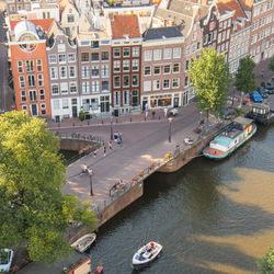 High angle view of river amidst buildings in city