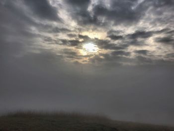 Scenic view of field against sky during sunset