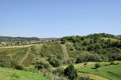 Scenic view of land against clear blue sky