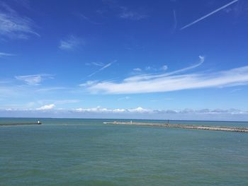 Scenic view of sea against blue sky