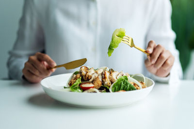 Midsection of man having food