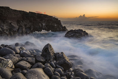 Scenic view of sea against sky during sunset