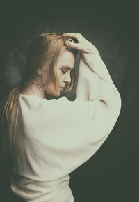 Portrait of blonde woman in white blouse vi