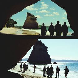 People in front of sea against sky