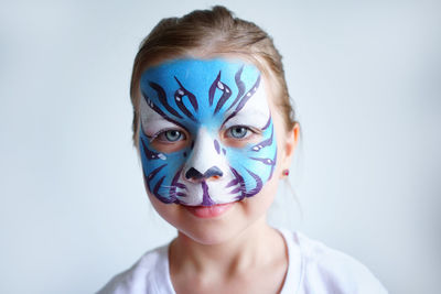 Girl aqua makeup in the form of a blue water tiger zodiac on a white background.