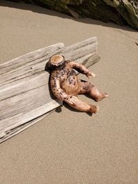 High angle view of lying on sand at beach