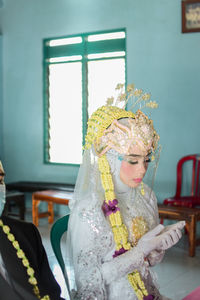 Midsection of woman wearing mask