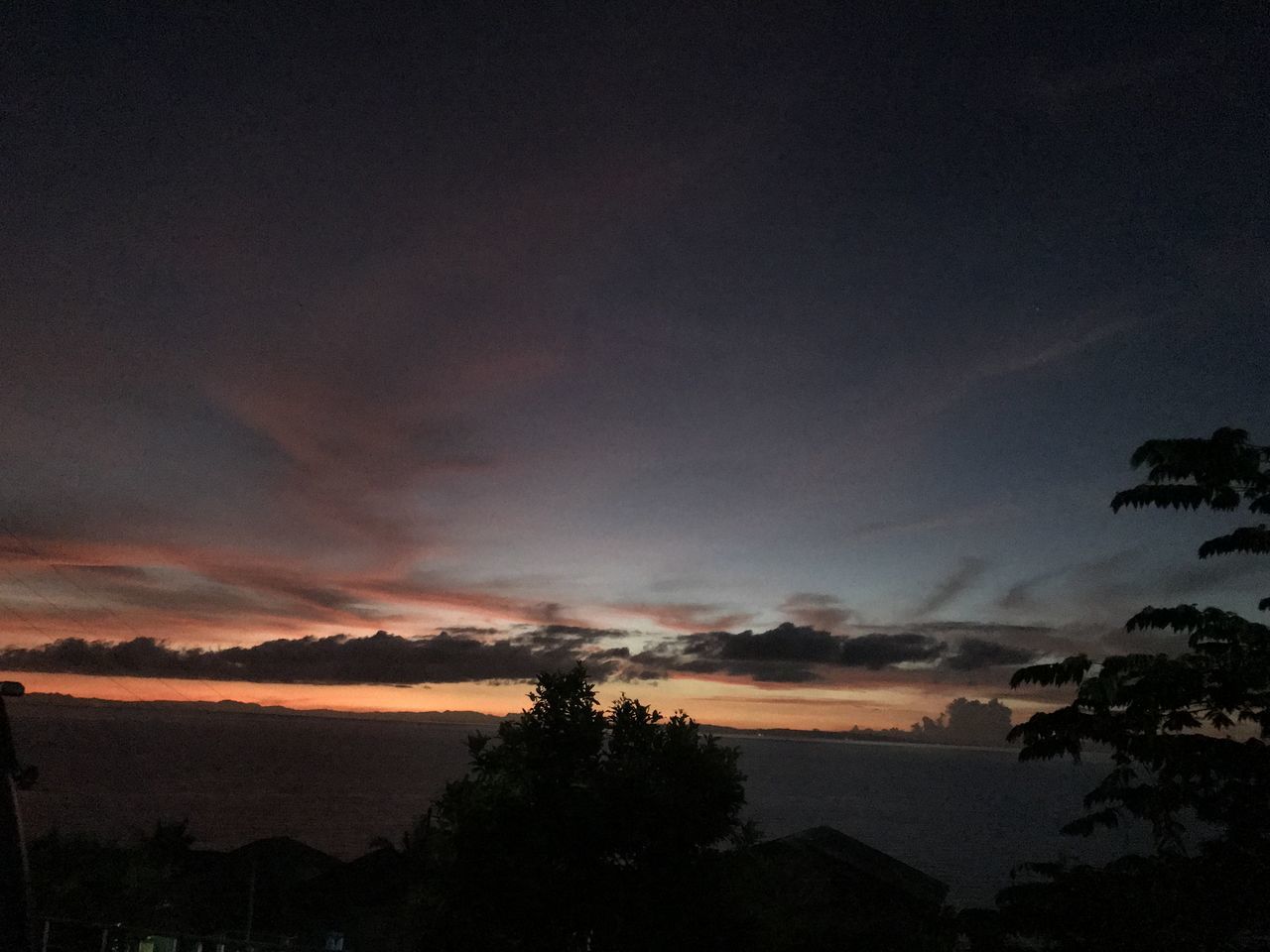 sky, cloud, beauty in nature, tree, scenics - nature, nature, sunset, plant, silhouette, dawn, tranquility, no people, environment, afterglow, landscape, evening, darkness, tranquil scene, night, dramatic sky, mountain, outdoors, water, land, horizon, dark, idyllic