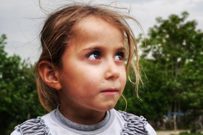 Close-up portrait of a girl looking away