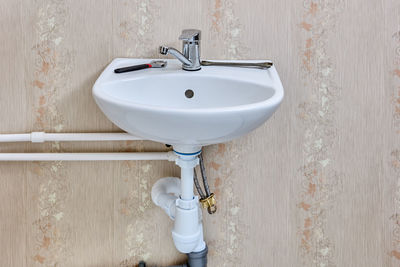 Close-up of faucet in bathroom