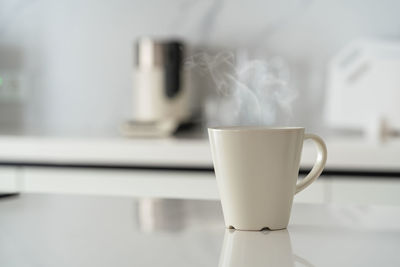 Close-up of coffee cup on table