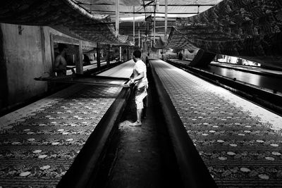 Man walking in illuminated railroad station