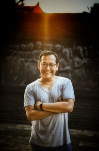 Portrait of smiling young man standing outdoors