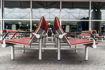 Empty chairs and tables at airport