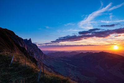 Scenic view of mountains against sky during sunset