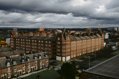 High angle view of buildings in city against sky