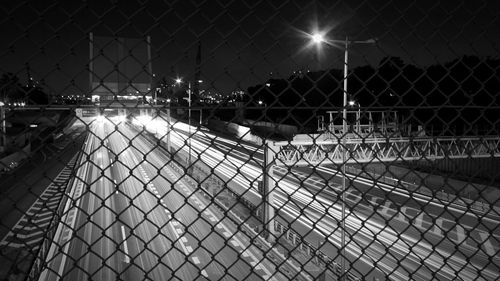 Illuminated city against sky at night