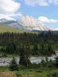 Scenic view of mountains against cloudy sky