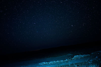 Scenic view of star field against sky at night