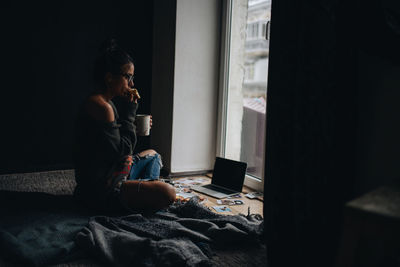 Side view of man using mobile phone