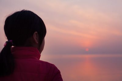 Silhouette of woman at sunset