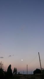 Low angle view of landscape against sky at dusk