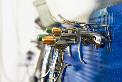 Close-up of clothes hanging on metal