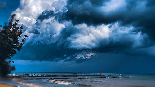 Scenic view of sea against dramatic sky