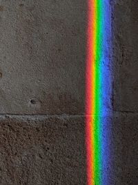 Full frame shot of rainbow over wall