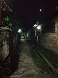 View of illuminated street at night