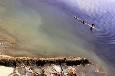 High angle view of people on sea against sky