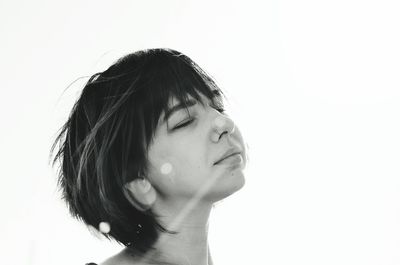 Close-up portrait of a girl over white background