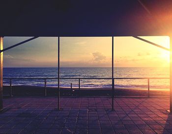 Scenic view of beach against sky during sunset