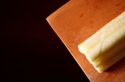 High angle view of bread on table against black background