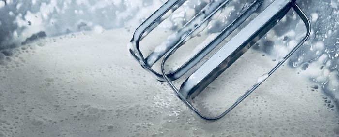 Close-up of wet glass on table