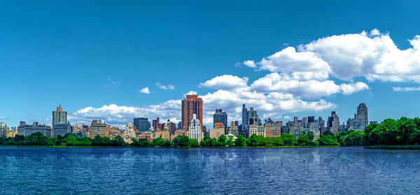 Panoramic view of buildings in city against sky