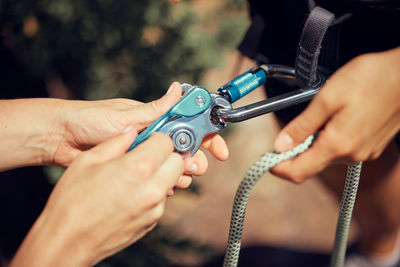 Cropped hand of man repairing vehicle part