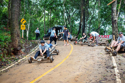 Group of people sitting in forest