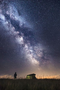 Scenic view of field against sky at night