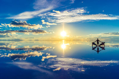 Scenic view of lake against sky during sunset