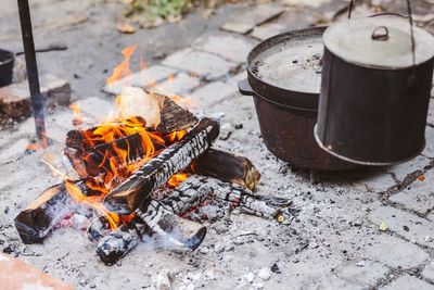 High angle view of bonfire on wooden floor