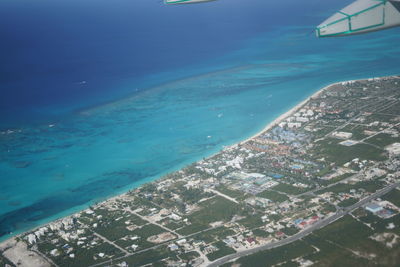Aerial view of sea seen through airplane window
