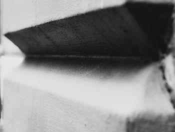 Close-up of open book against wall