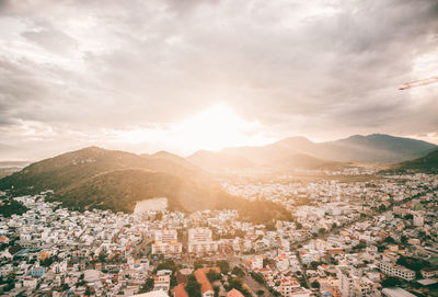 Aerial view of townscape against sky during sunset