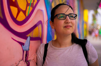 Portrait of young woman wearing sunglasses