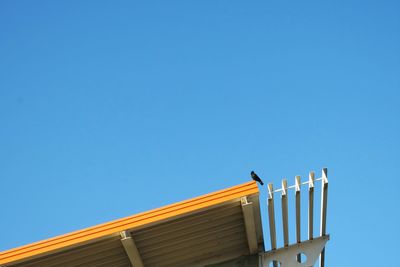 Low angle view of built structure against blue sky