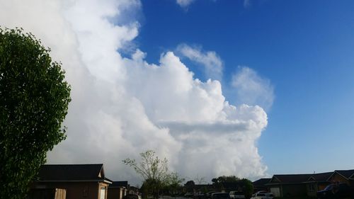 Low angle view of building against cloudy sky