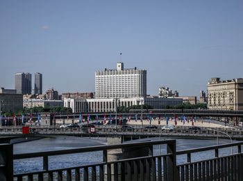 Buildings in city against clear sky