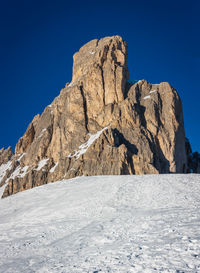 Scenic view of snowcapped mountains against clear blue sky